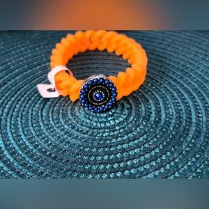 Vibrant Orange Silicone Twisted Bracelet with Blue Beaded Accent Charm